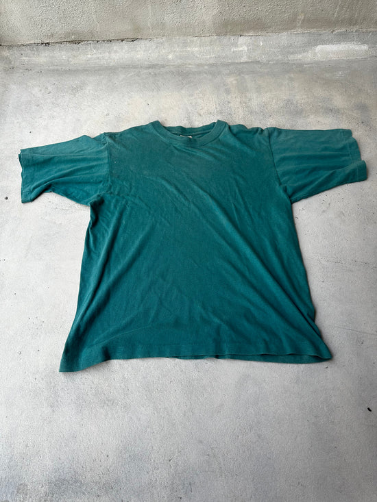 Laid-flat vintage green T-shirt featuring classic boxy fit and single stitch construction