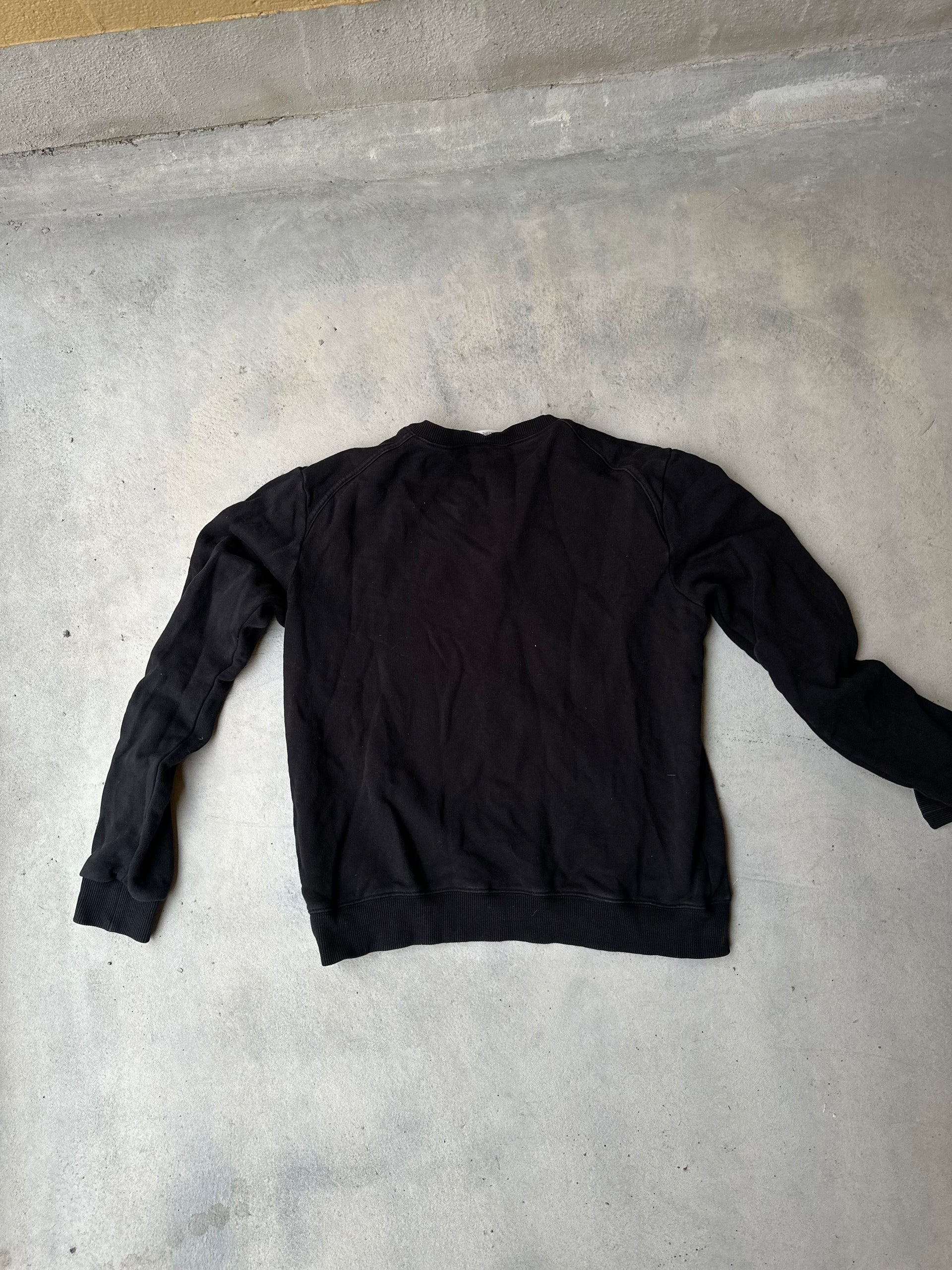 Vintage-inspired Saint Laurent crewneck with edgy design.