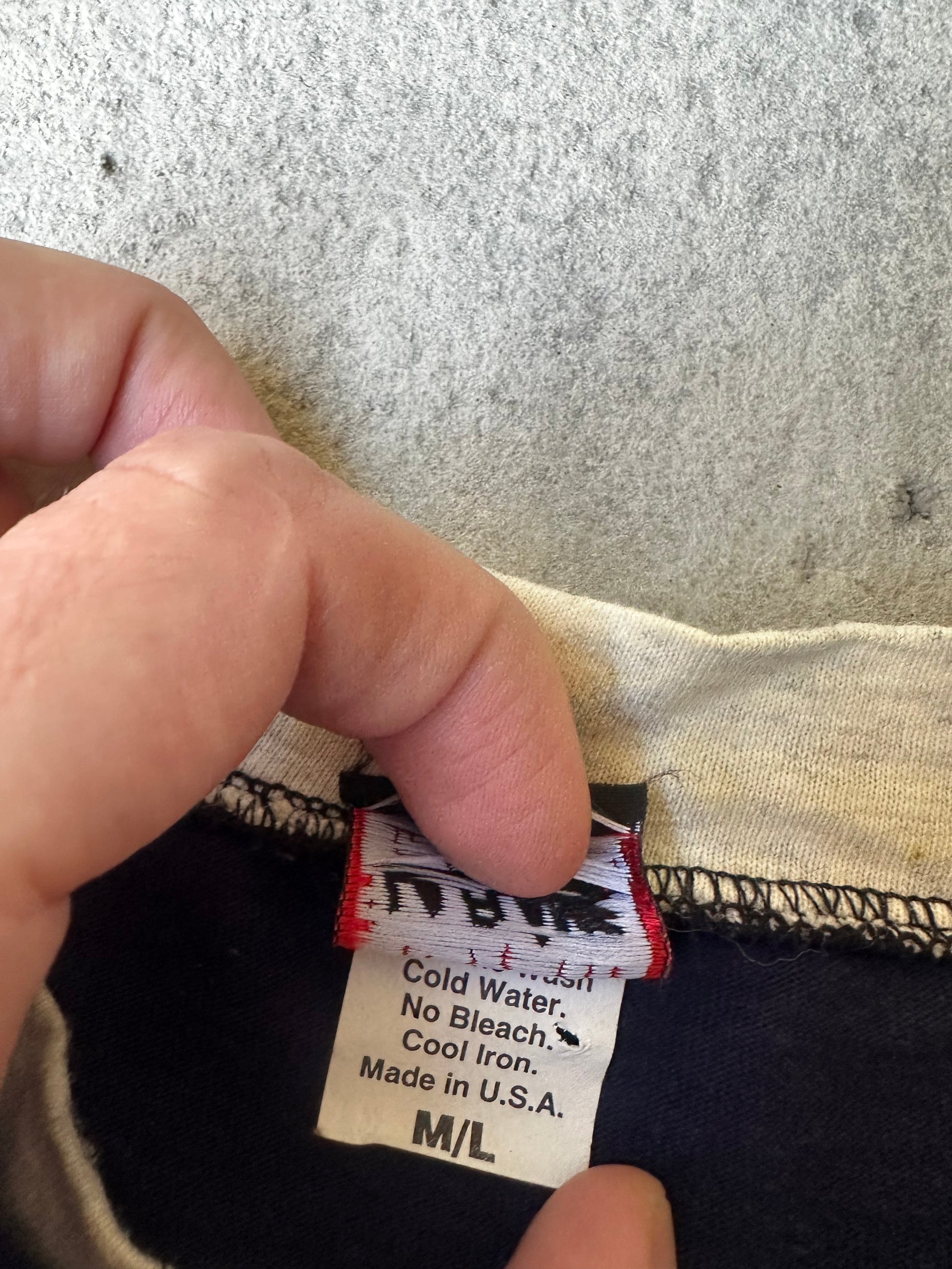 Vintage made-in-USA T-shirt with collegiate-style lettering and flag graphic.