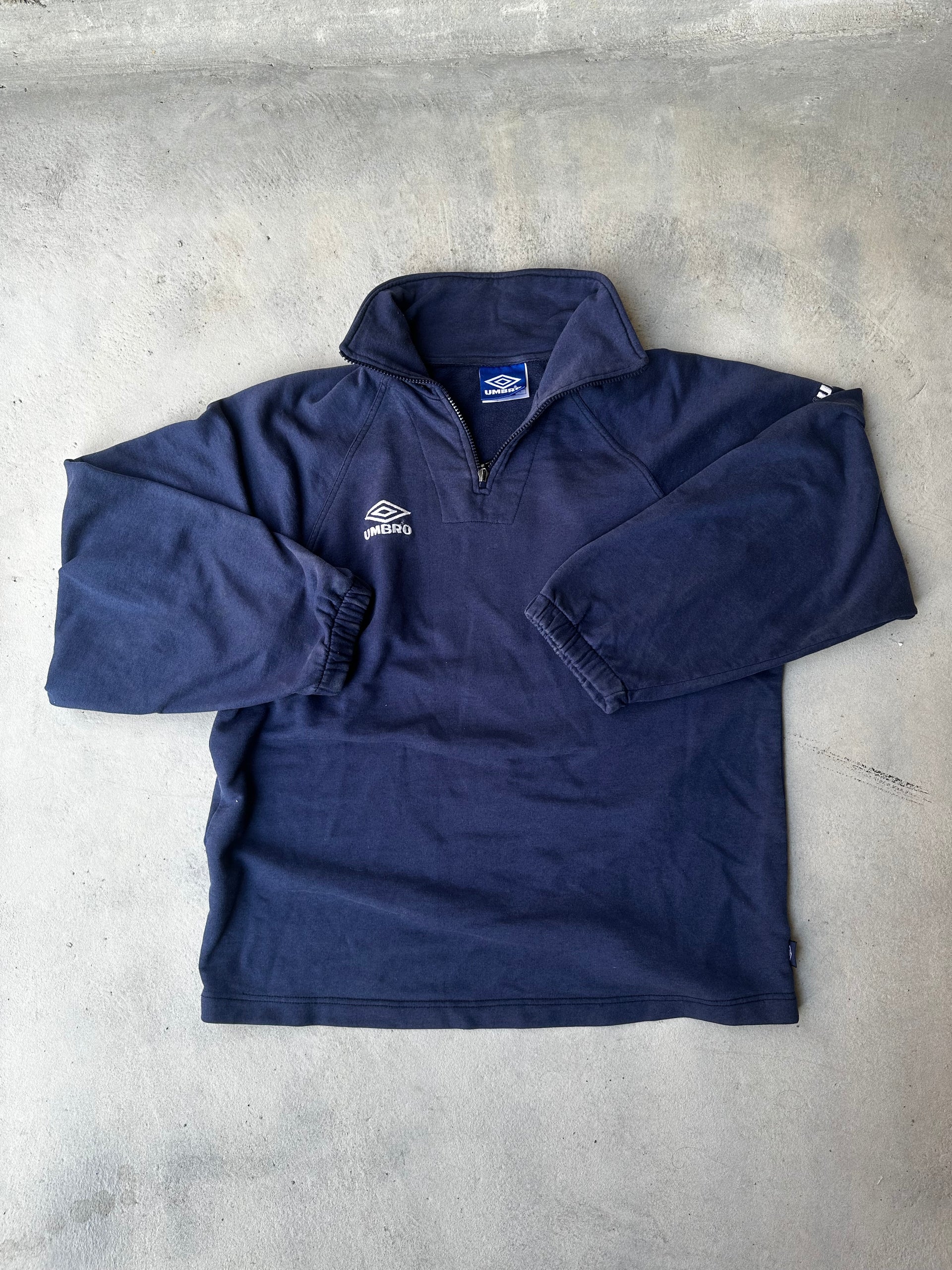 Retro Umbro fleece-lined training top.