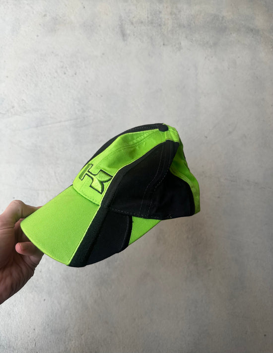 Two-tone Kawasaki motorsports hat featuring bold branding and curved brim.