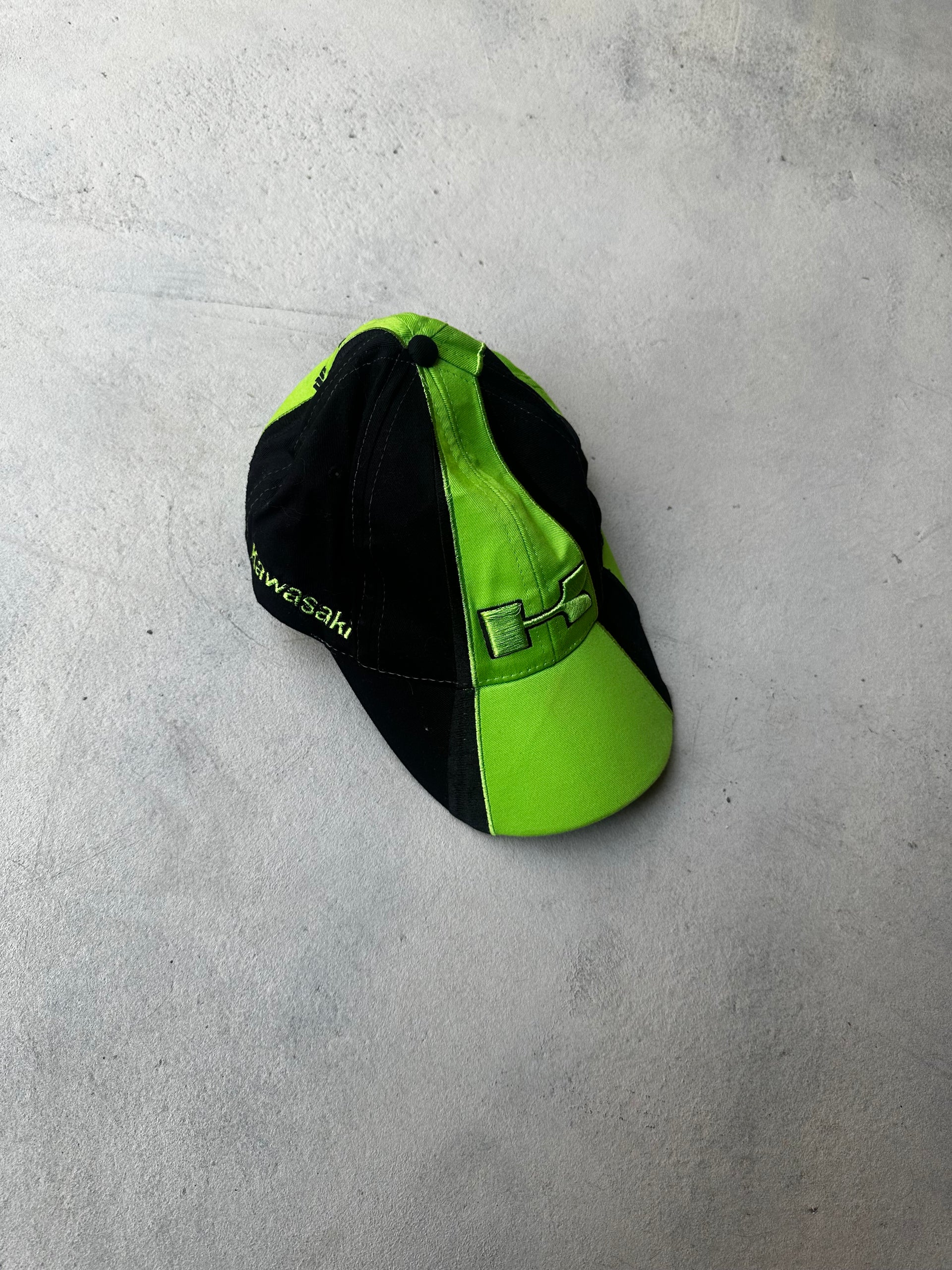Vintage Kawasaki racing cap in black and neon green with embroidered logos.