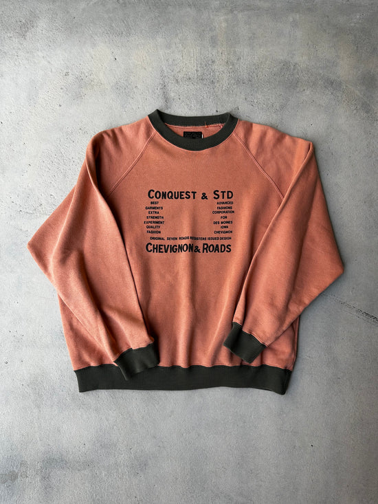 Vintage Chevignon & Roads sweatshirt in faded burnt orange with graphic print.