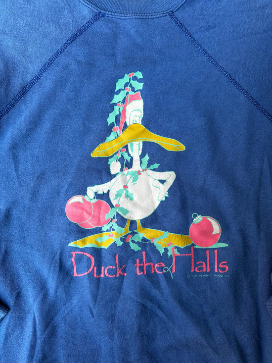 "Festive 90s crewneck sweatshirt featuring a holiday-themed duck graphic."