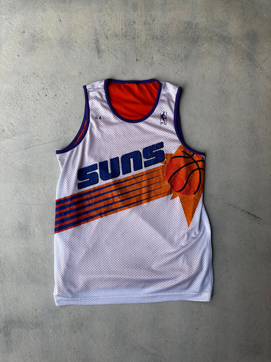 Vintage 90s Phoenix Suns basketball jersey with bold graphic print.