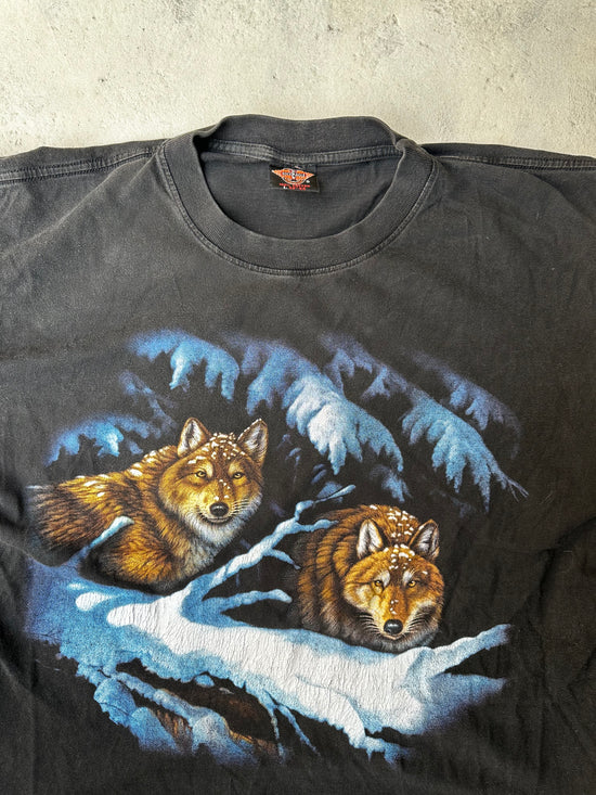 Close-up of faded wolf graphic on vintage single stitch black tee