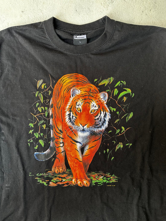 "Close-up of detailed tiger graphic on vintage wildlife T-shirt."