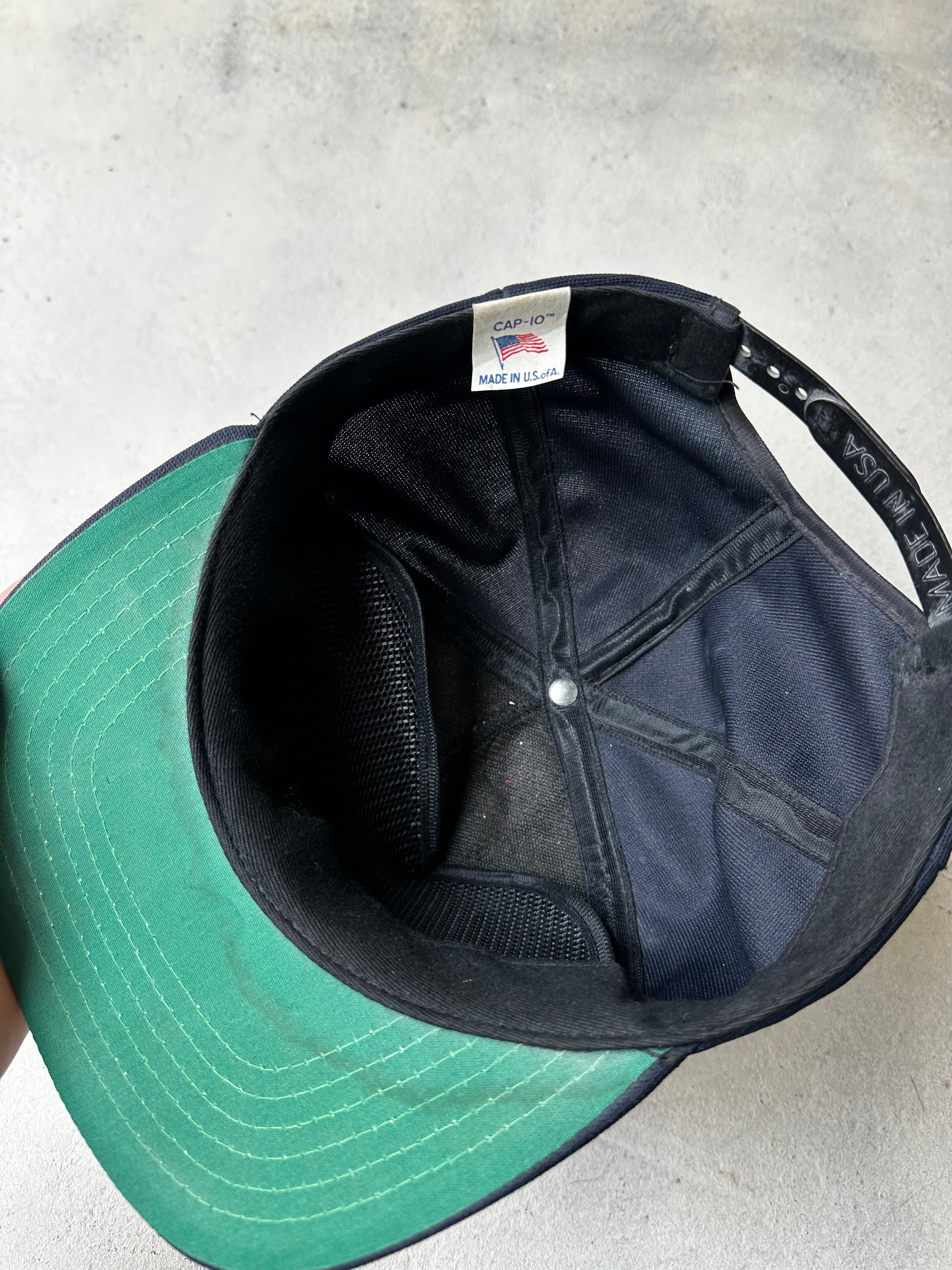 Inside of USS Milwaukee AOR-2 cap, made in the usa tag.