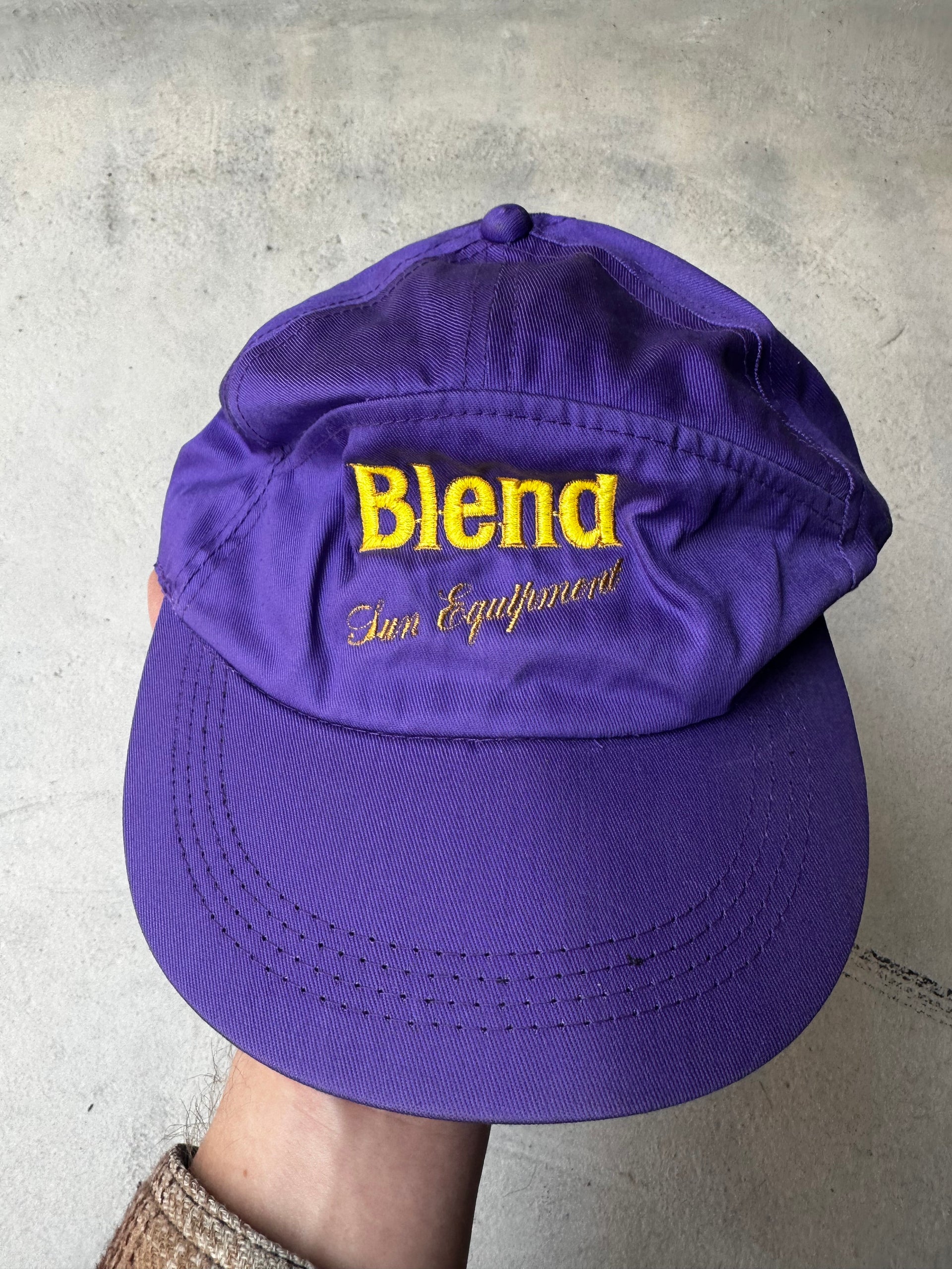 Vintage purple Blend Sun Equipment cap with embroidered yellow logo.