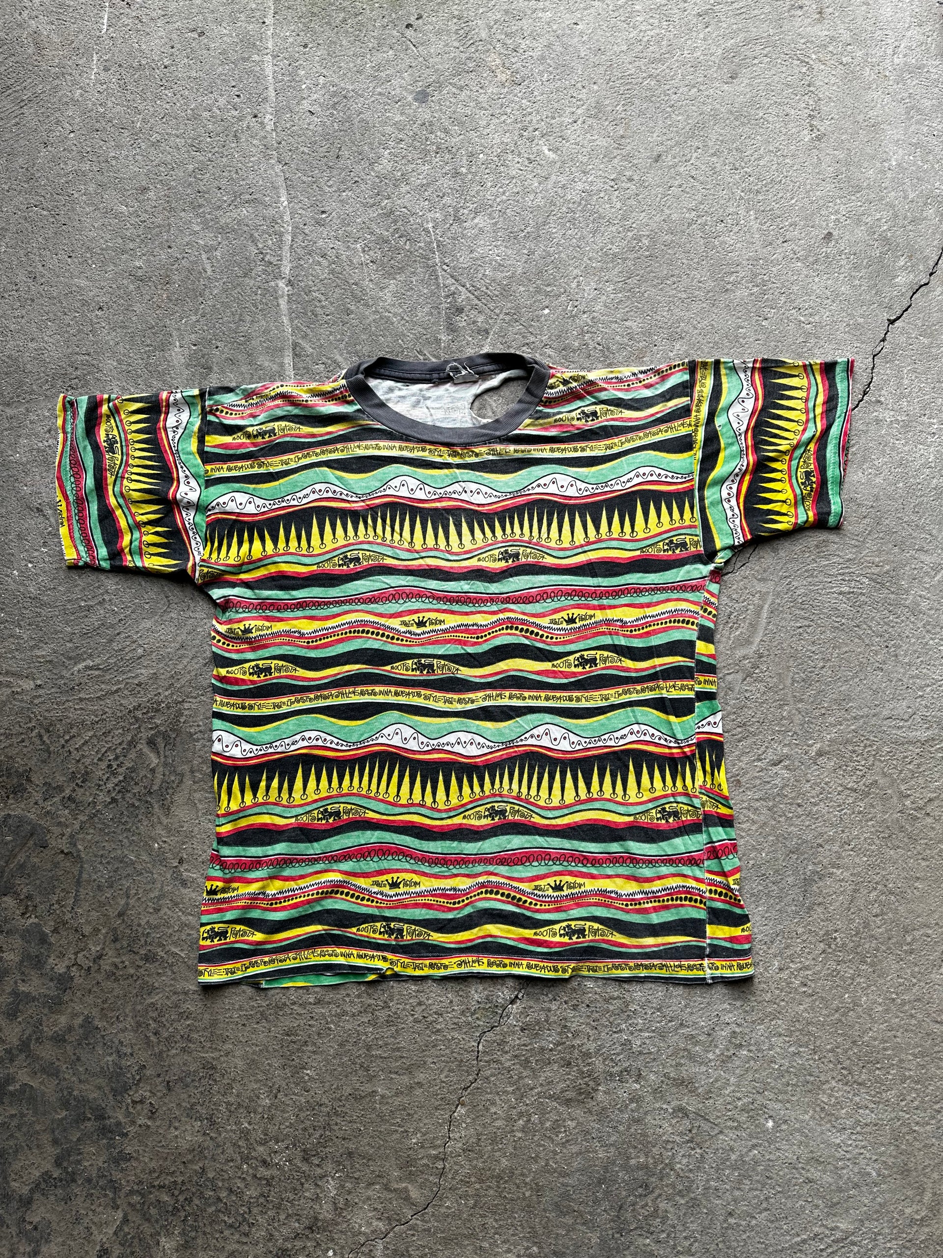 Vintage 1990s Stüssy Rasta graphic t-shirt heavy distressed faded streetwear size S/M