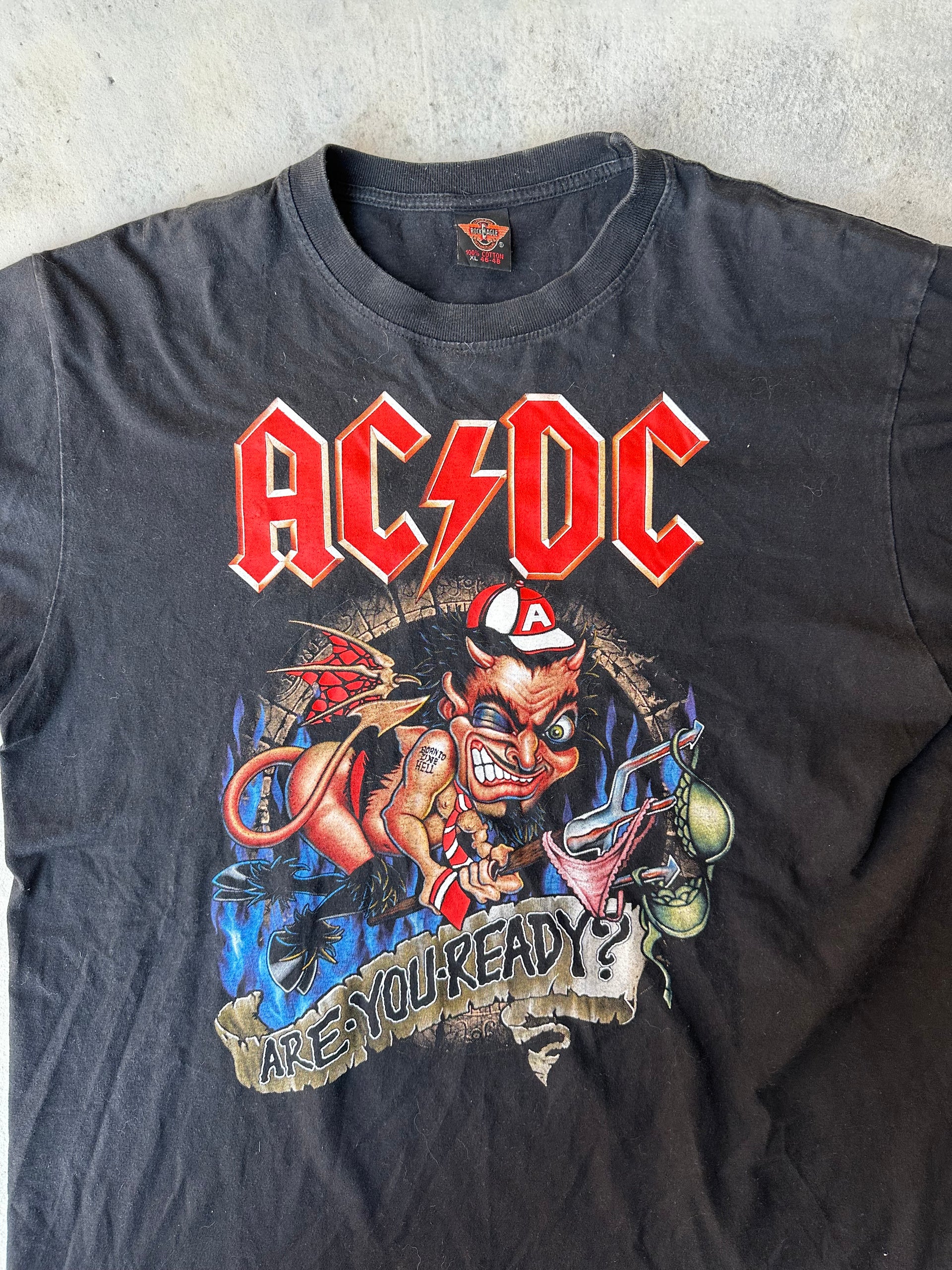 Rare AC/DC 90s T-Shirt – Bold graphic print, classic rock tour merch.
