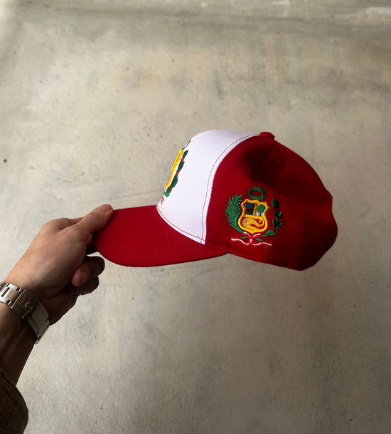 Classic mesh back Peru emblem cap with bold red brim