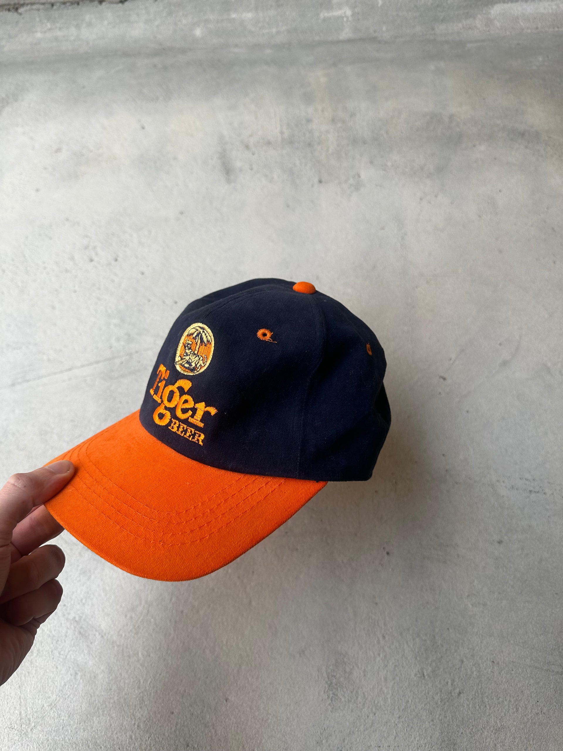 Embroidered Tiger Beer logo on classic adjustable baseball cap