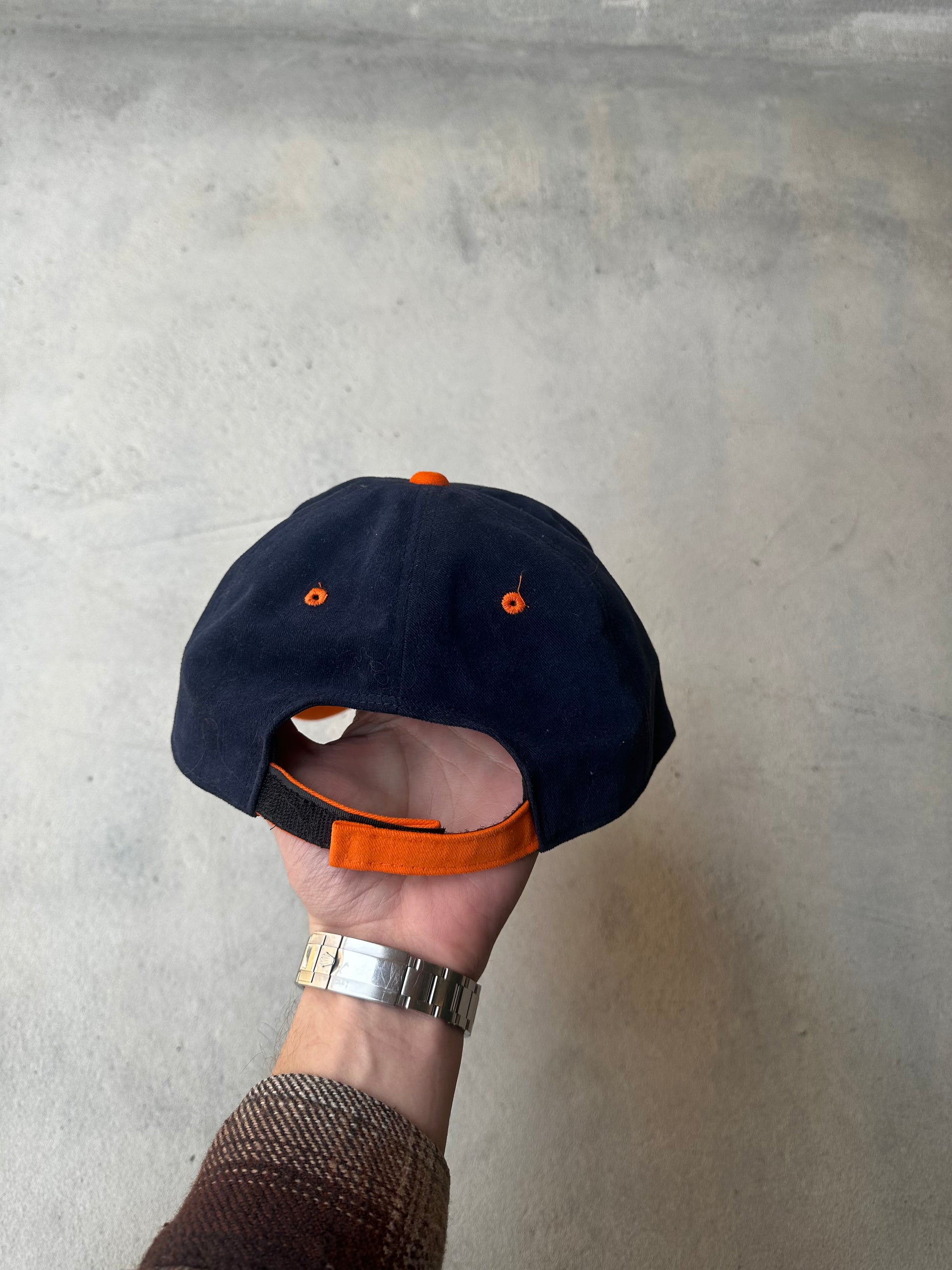 Laid-flat two-tone Tiger Beer cap with curved brim and adjustable back.