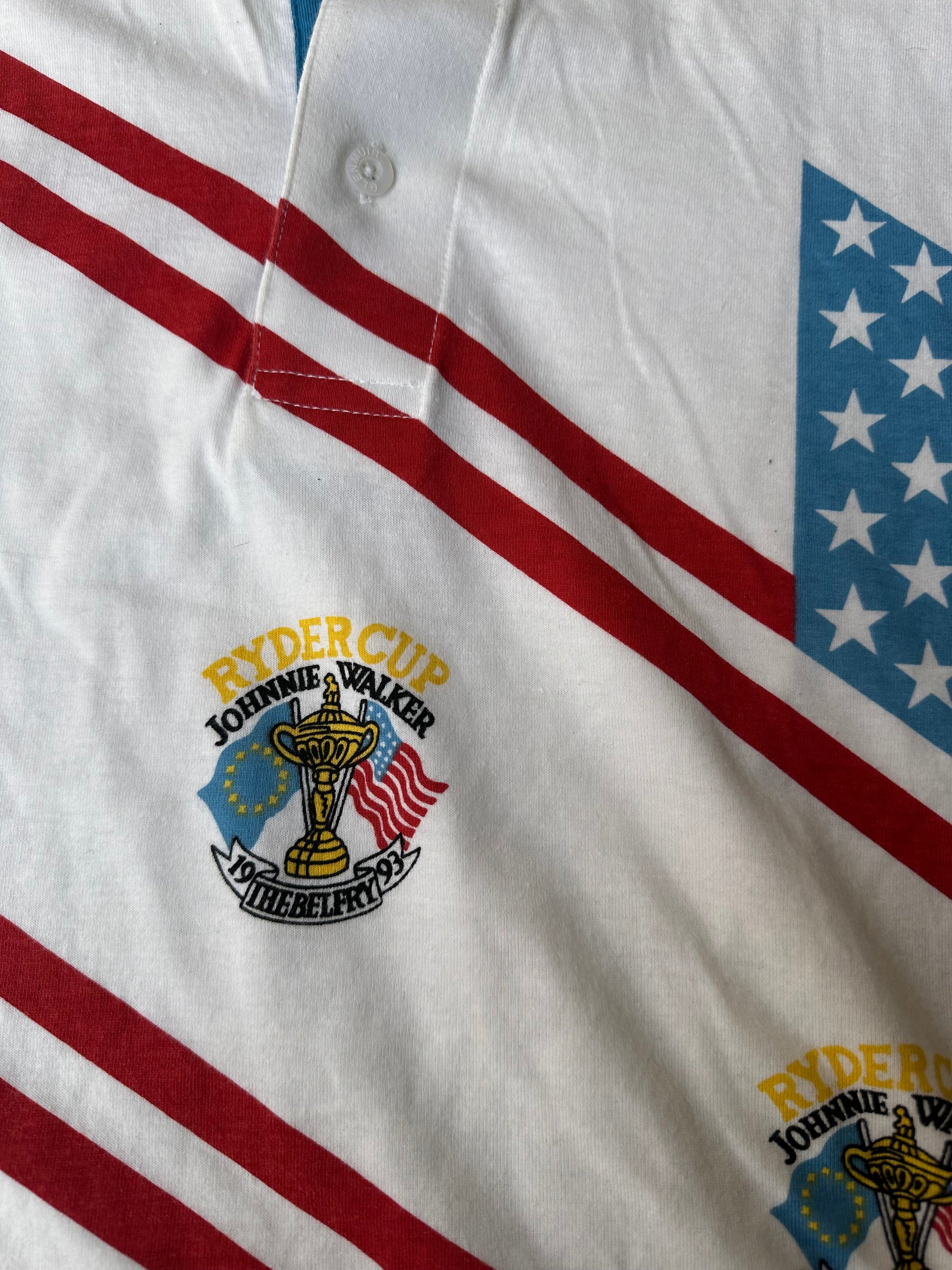 Close-up of embroidered Ryder Cup 1993 crest on vintage white polo shirt