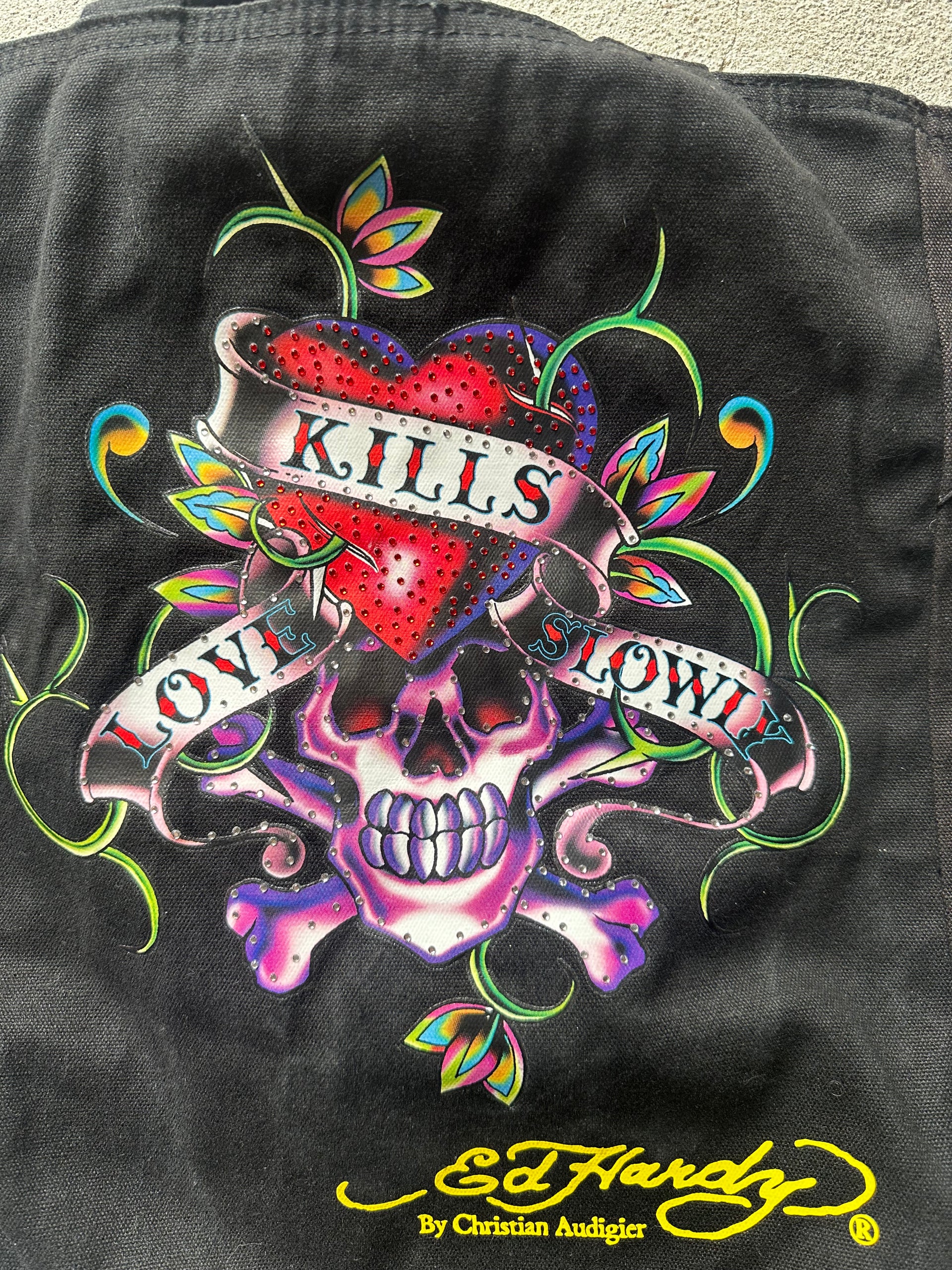 Close-up of Ed Hardy 'Kills Love Slowly' embroidery on black canvas reversible tote bag